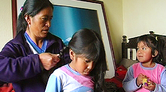 Flowerfarm worker at home with her children